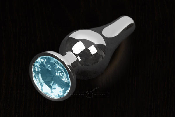 Анальная пробка маленькая Пикантные Штучки с голубым кристаллом, серебристая, 8.5 см